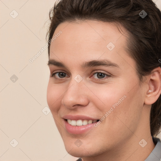 Joyful white young-adult male with medium  brown hair and brown eyes