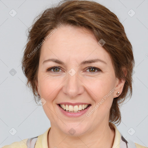 Joyful white adult female with medium  brown hair and grey eyes