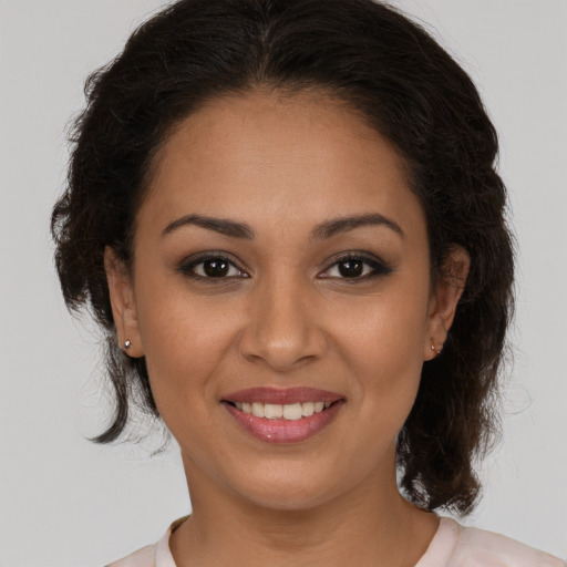 Joyful white young-adult female with long  brown hair and brown eyes