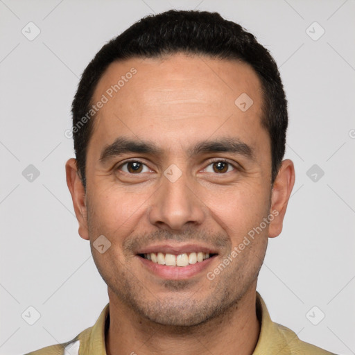 Joyful white young-adult male with short  black hair and brown eyes