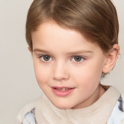 Joyful white child female with short  brown hair and grey eyes