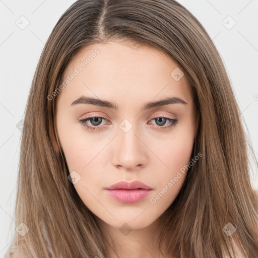 Neutral white young-adult female with long  brown hair and brown eyes