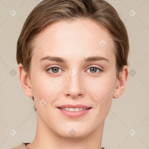 Joyful white young-adult female with short  brown hair and grey eyes