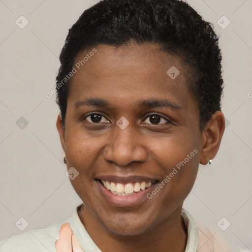 Joyful black young-adult male with short  brown hair and brown eyes