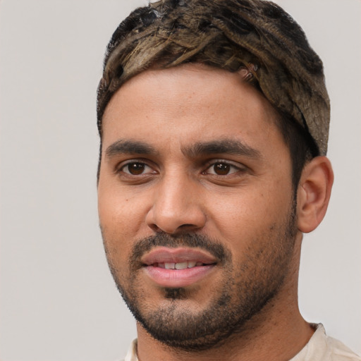 Joyful white young-adult male with short  black hair and brown eyes