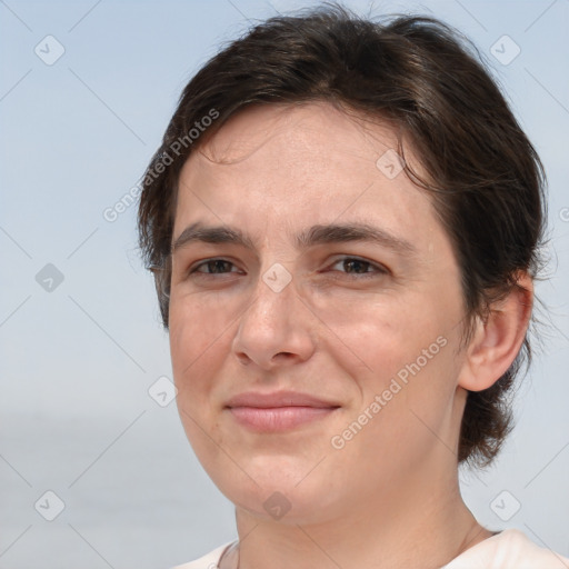 Joyful white adult female with medium  brown hair and brown eyes