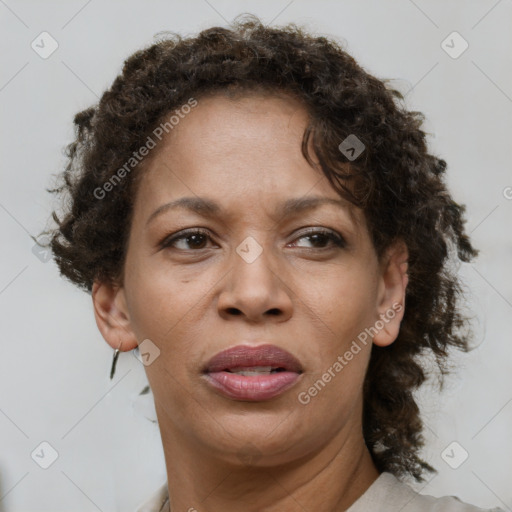 Joyful black adult female with short  brown hair and brown eyes
