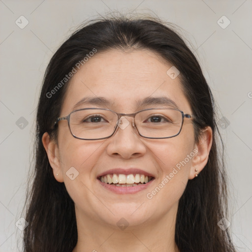 Joyful white adult female with long  brown hair and brown eyes