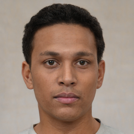 Neutral latino young-adult male with short  brown hair and brown eyes