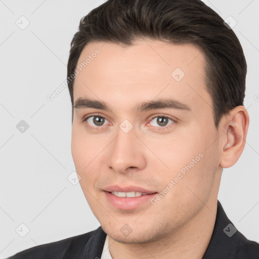 Joyful white young-adult male with short  brown hair and brown eyes