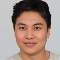 Joyful asian young-adult male with short  brown hair and brown eyes