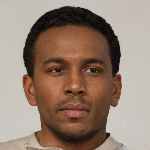 Neutral latino young-adult male with short  brown hair and brown eyes