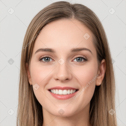 Joyful white young-adult female with long  brown hair and grey eyes