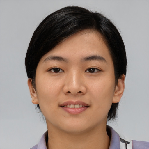 Joyful asian young-adult female with medium  black hair and brown eyes