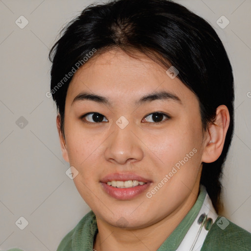 Joyful asian young-adult female with medium  brown hair and brown eyes