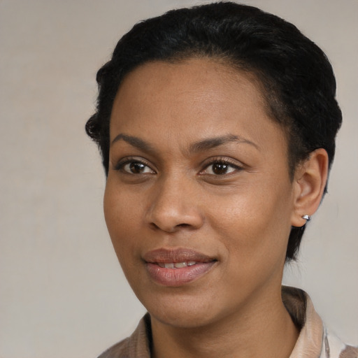 Joyful latino young-adult female with short  black hair and brown eyes