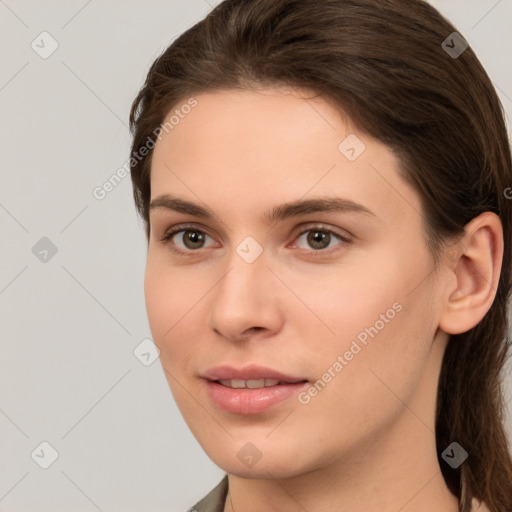 Neutral white young-adult female with long  brown hair and brown eyes