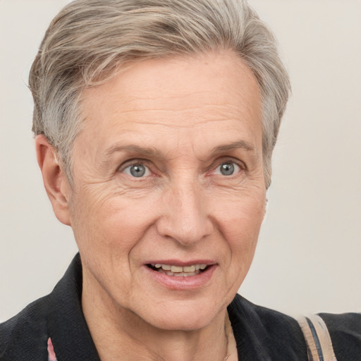 Joyful white middle-aged female with short  gray hair and grey eyes