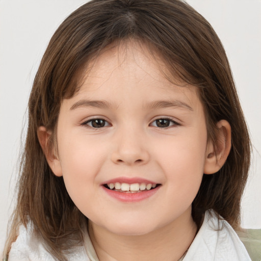 Joyful white child female with medium  brown hair and brown eyes