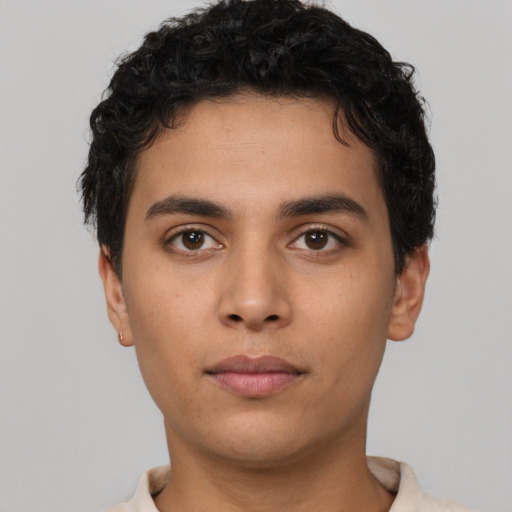 Neutral latino young-adult male with short  black hair and brown eyes