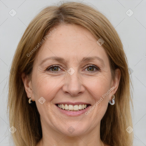 Joyful white adult female with medium  brown hair and grey eyes