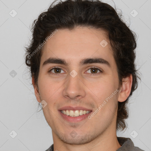 Joyful white young-adult male with medium  brown hair and brown eyes