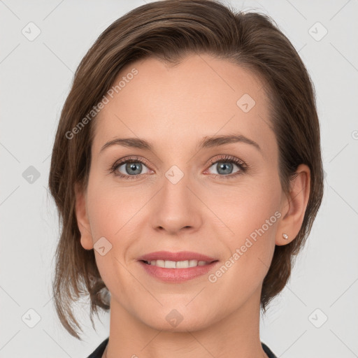 Joyful white young-adult female with medium  brown hair and grey eyes