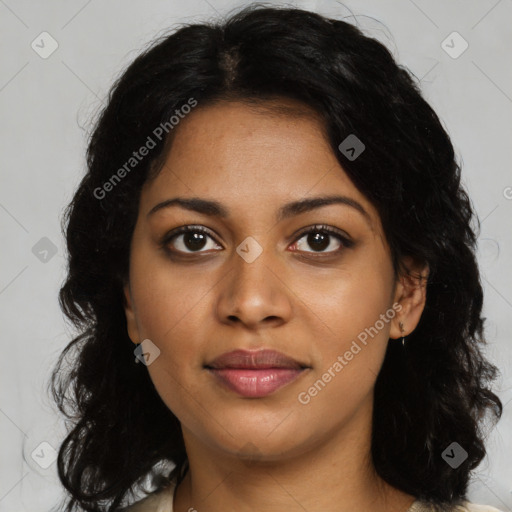 Joyful black young-adult female with long  brown hair and brown eyes