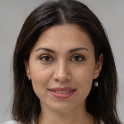 Joyful white young-adult female with medium  brown hair and brown eyes