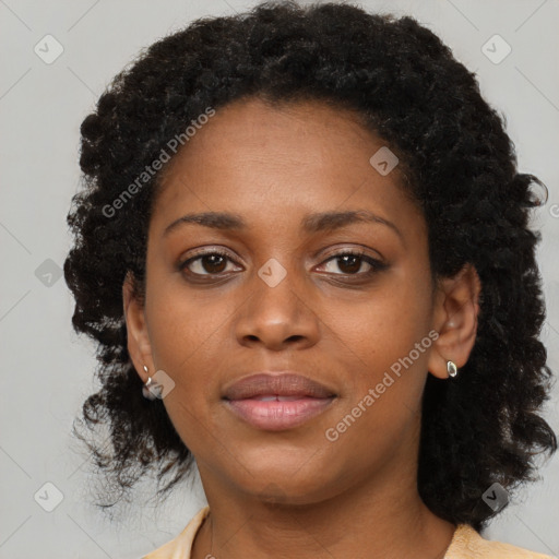 Joyful black young-adult female with medium  black hair and brown eyes