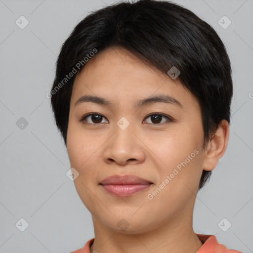 Joyful asian young-adult female with short  brown hair and brown eyes