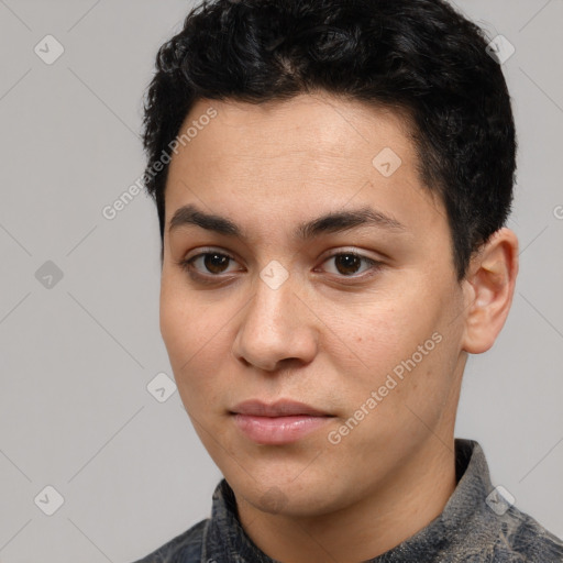 Joyful white young-adult male with short  black hair and brown eyes