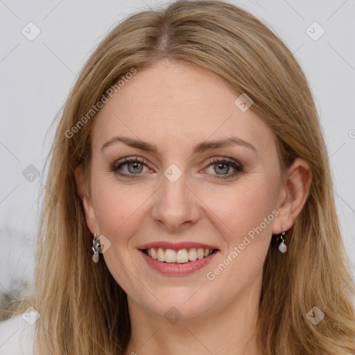 Joyful white young-adult female with long  brown hair and blue eyes