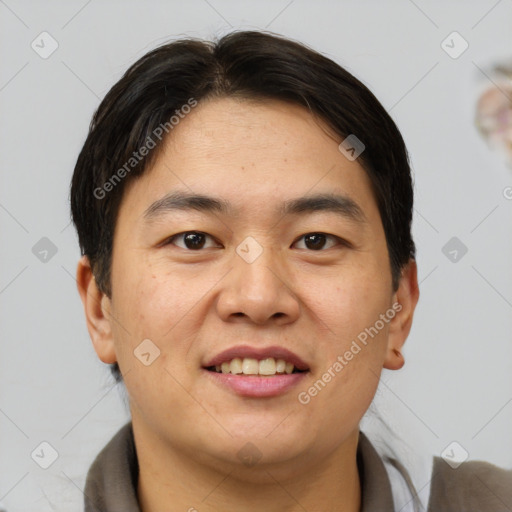 Joyful asian young-adult male with short  brown hair and brown eyes