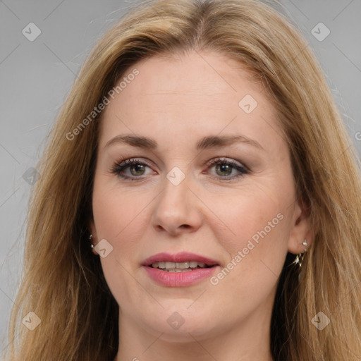 Joyful white adult female with long  brown hair and brown eyes