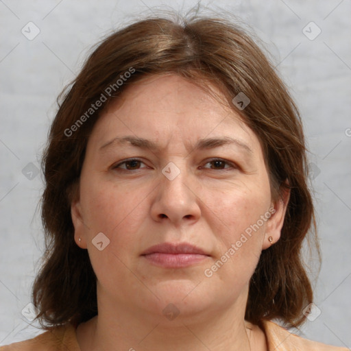 Joyful white adult female with medium  brown hair and brown eyes