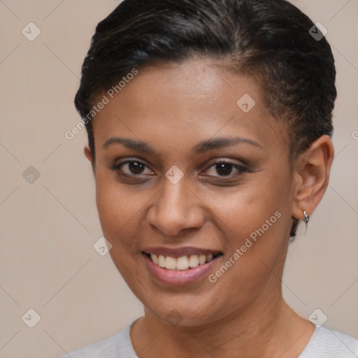 Joyful latino young-adult female with short  brown hair and brown eyes