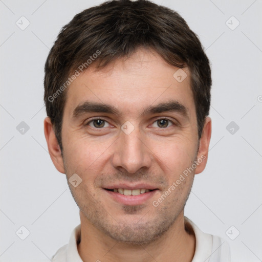 Joyful white young-adult male with short  brown hair and brown eyes