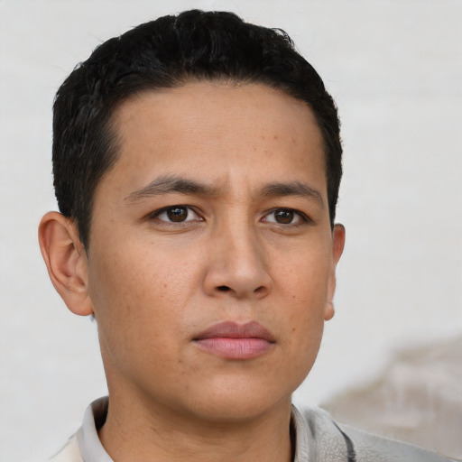 Neutral white young-adult male with short  black hair and brown eyes