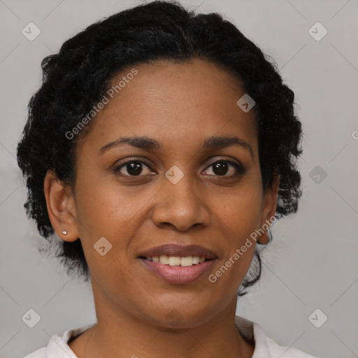 Joyful black adult female with short  brown hair and brown eyes