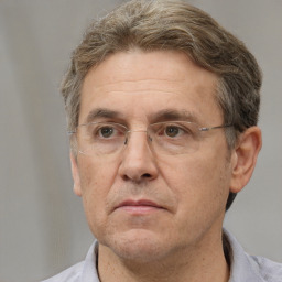 Neutral white middle-aged male with short  brown hair and brown eyes