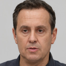 Neutral white adult male with short  brown hair and brown eyes