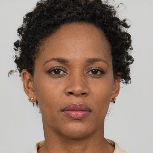 Neutral black adult female with short  brown hair and brown eyes