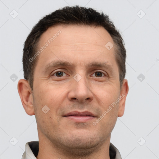 Joyful white adult male with short  brown hair and brown eyes