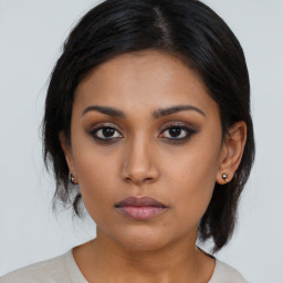 Neutral asian young-adult female with medium  brown hair and brown eyes