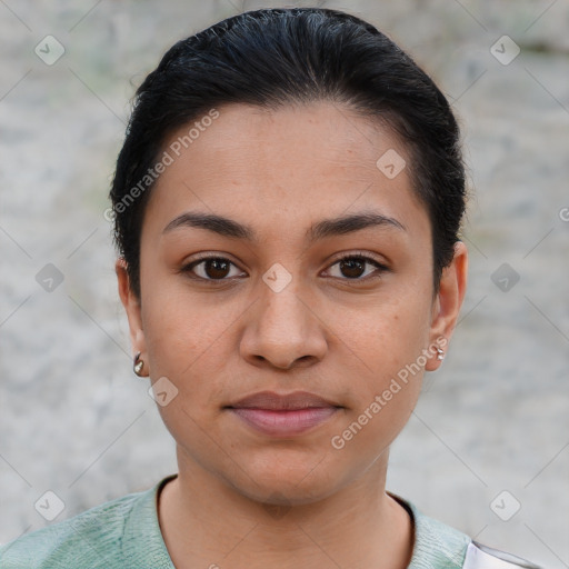 Joyful latino young-adult female with short  brown hair and brown eyes