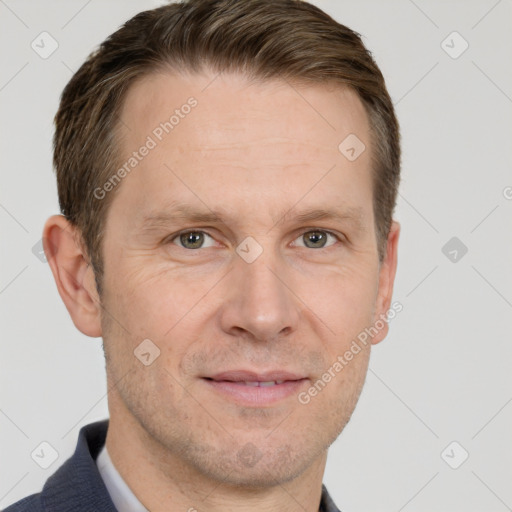 Joyful white adult male with short  brown hair and grey eyes