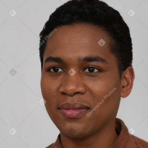 Joyful black young-adult male with short  black hair and brown eyes