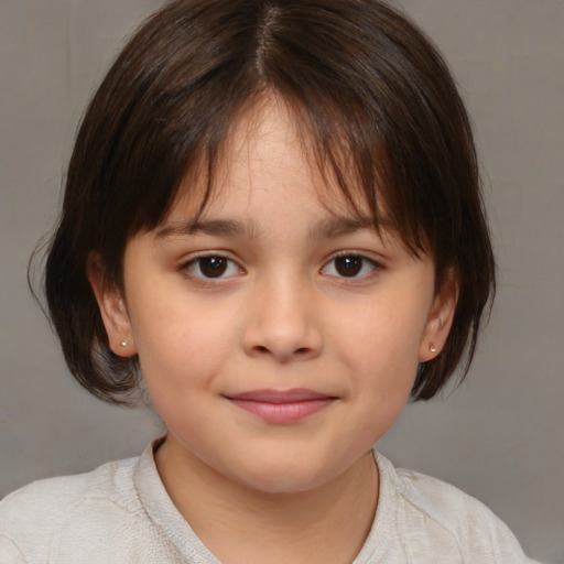 Joyful white child female with medium  brown hair and brown eyes