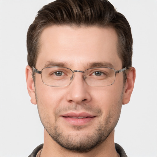 Joyful white adult male with short  brown hair and brown eyes